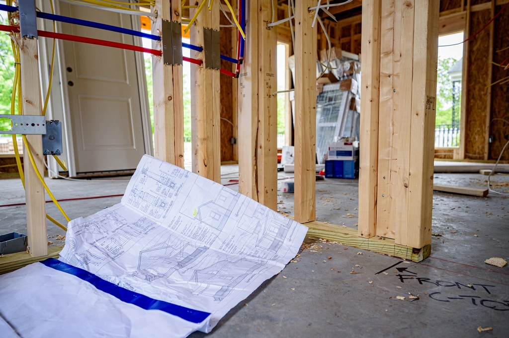 Framing and blueprints on a job site
