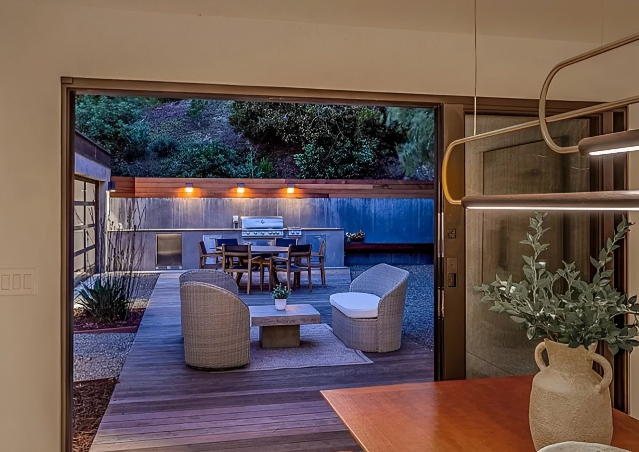 Wood deck with lounge seating and built-in outdoor kitchen